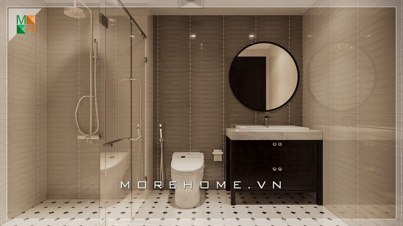 Phòng tắm hiện đại có một kệ tủ lavobo gỗ tự nhiên nhỏ gọn màu nâu trầm, gương tròn để trang trí, vách tắm kính đẹp và các thiết bị vệ sinh cao cấp.
